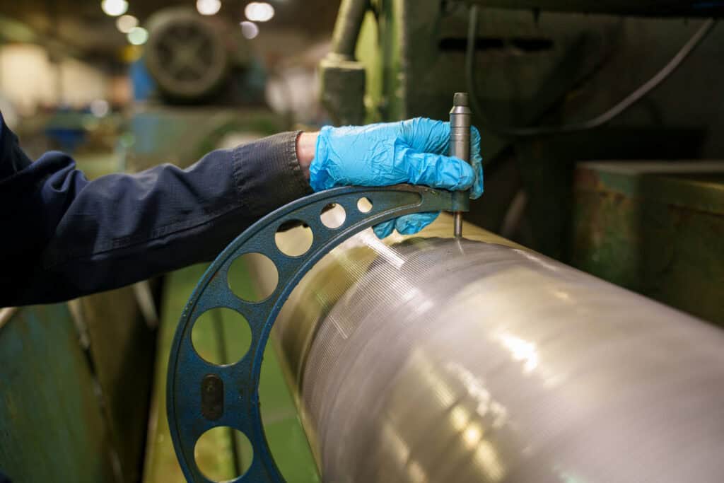 man measuring roll